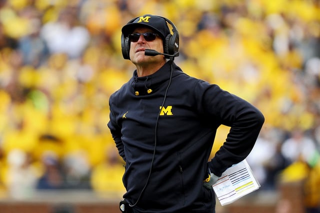 Head coach Jim Harbaugh of the Michigan Wolverines looks on in the first half in a game against the Penn State Nittany Lionsat Michigan Stadium on October 15, 2022 in Ann Arbor, Michigan.