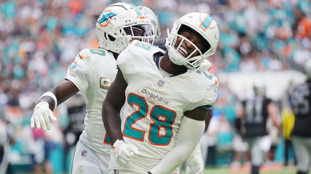 Nov 17, 2024; Miami Gardens, Florida, USA; Miami Dolphins running back De&#39;Von Achane (28) celebrates a touchdown against the Las Vegas Raiders with wide receiver Tyreek Hill (10) at Hard Rock Stadium. Mandatory Credit: Jim Rassol-Imagn Images