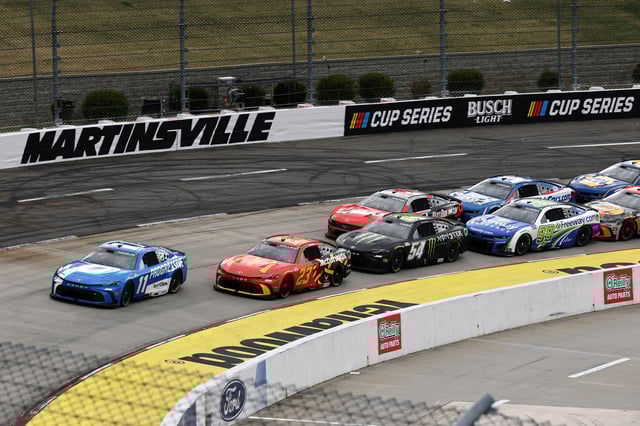 Denny Hamlin, driver of the #11 Progressive Toyota, leads the field during the NASCAR Cup Series Cook Out 400 at Martinsville Speedway on March 30, 2025 in Martinsville, Virginia.