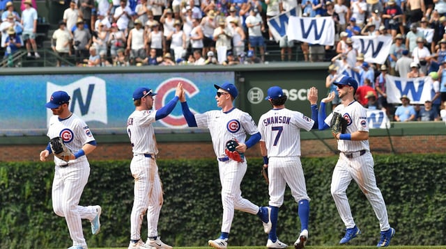 Aug 16, 2025; Chicago, Illinois, USA; The Chicago Cubs celebrate after defeating the Pittsburgh Pirates at Wrigley Field. Mandatory Credit: Patrick Gorski-Imagn Images