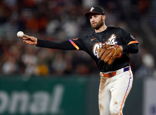 San Francisco Giants’ Casey Schmitt (10) throws to first base for an out on a hit by San Diego Padres’ Manny Machado (13) in the ninth inning at Oracle Park in San Francisco, Calif., on Tuesday, Aug. 12, 2025. (Nhat V. Meyer/Bay Area News Group)