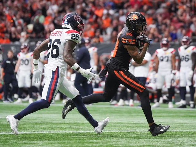 B.C. Lions' Justin McInnis scores a touchdown past Montreal Alouettes' Tyrice Beverette   Aug. 16 in Vancouver.