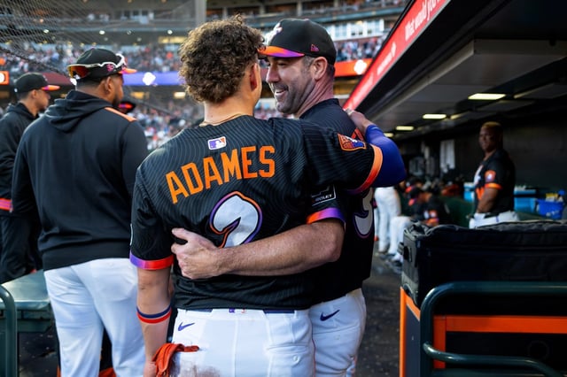 San Francisco Giants starting pitcher Justin Verlander (35) smiles as he hugs teammate Willy Adames (2) in the seventh inning of their MLB game at Oracle Park in San Francisco, Calif., on Saturday, Aug. 16, 2025. (Jose Carlos Fajardo/Bay Area News Group)