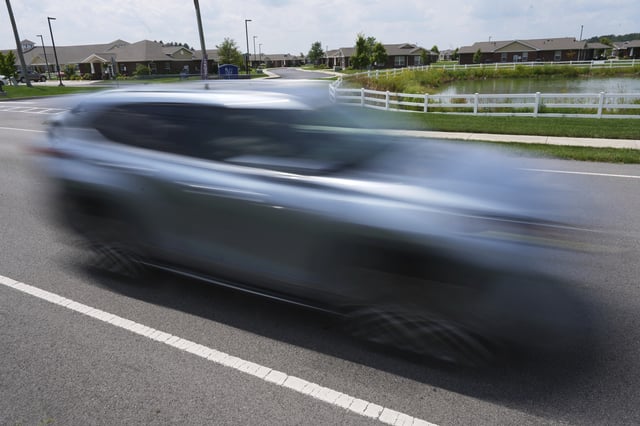 A vehicle drives on Mitchaw Road past The Lakes of Sylvania senior living community Thursday, Aug. 7, 2025, in Sylvania Township, Ohio. (AP Photo/Paul Sancya)