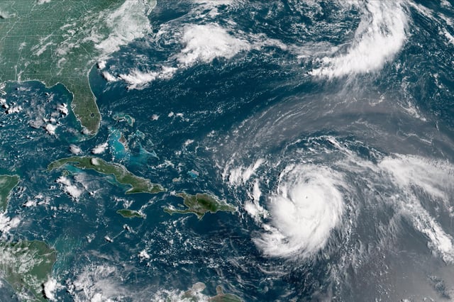 Hurricane Erin, which is the first hurricane of the 2025 Atlantic season and has developed into a dangerous Category 4 hurricane, moves westward near Puerto Rico in a composite satellite image on August 16, 2025.