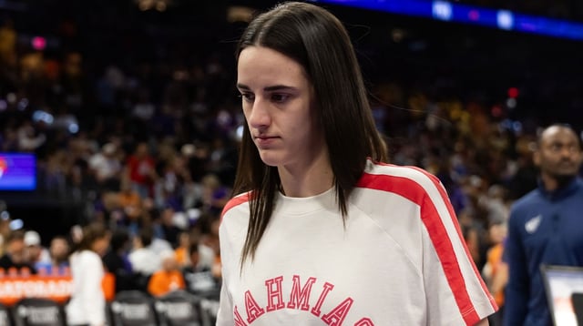 Aug 7, 2025; Phoenix, Arizona, USA; Indiana Fever injured guard Caitlin Clark in attendance against the Phoenix Mercury during an WNBA game at PHX Arena. Mandatory Credit: Mark J. Rebilas-Imagn Images