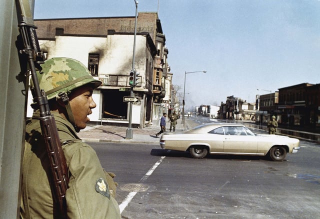 A National Guard soldier stands at the corner of 4th and H Streets in northeast Washington, DC, on April 6, 1968.