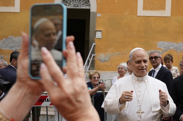 Pope Leo XIV is cheered by faithful as he arrives to celebrate a Mass at the Santa Maria della Rotonda Sanctuary in Albano Laziale, Sunday, Aug. 17, 2025. (AP Photo/Gregorio Borgia)