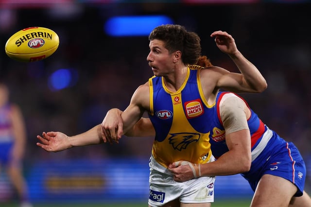 Liam Baker fights for the footy.