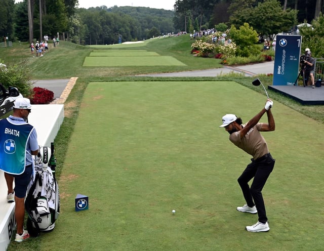 Akshay Bhatia tees off to start his second round play in the 2025 BMW Championship golf tournament at Caves Valley Golf Club. (Kenneth K. Lam/staff)
