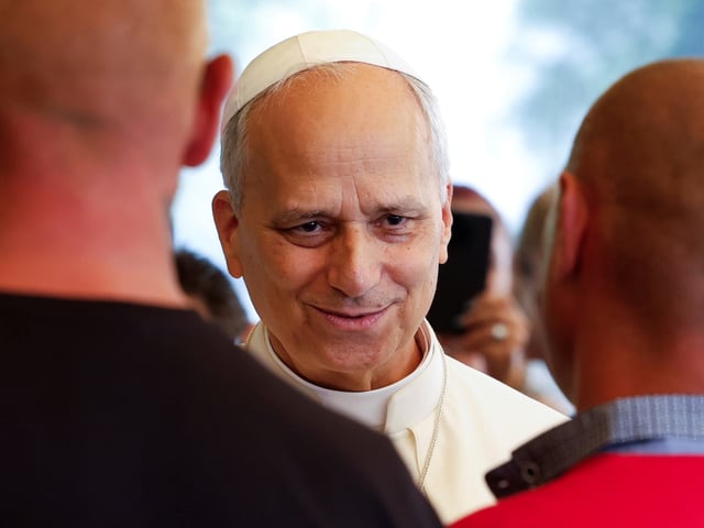 Pope Leo XIV attends a festive lunch with the poor of the Diocese of Albano Laziale at Borgo Laudato Si, in the garden of the Pontifical Villas in Castel Gandolfo, Italy, Sunday Aug. 17, 2025. (Remo Casilli/Pool via AP)