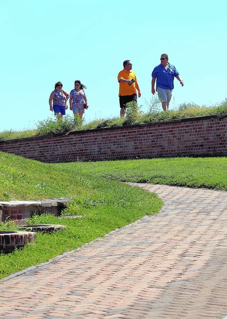 Guests walk along the ramparts of the the fort. Visitors explore Fort McHenry in Baltimore and learn about the War of 1812 and the Battle of Baltimore in 1814 on a sunny Thursday afternoon.