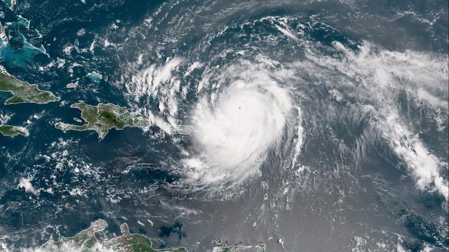 Hurricane Erin has weakened to a Category 3 storm but remains significant, with dangerous surf and rip currents expected along the Florida and East Coast. (Photo by Handout / NOAA / AFP) 
