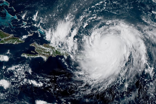 Hurricane Erin, which is the first hurricane of the 2025 Atlantic season, moves westward near Puerto Rico in a composite satellite image August 16, 2025.