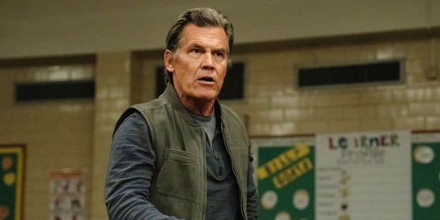 Josh Brolin gives a speech in a school.