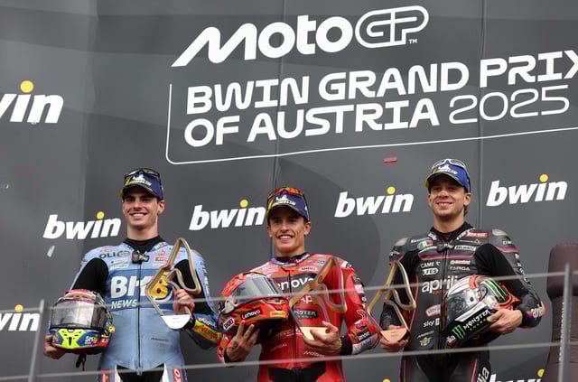 MotoGP - Austrian Grand Prix - Red Bull Ring, Spielberg, Austria - August 17, 2025 Ducati Lenovo Team's Marc Marquez celebrates with a trophy on the podium after winning the Austrian MotoGP with second placed BK8 Gresini Racing MotoGP's Fermin Aldeguer and third placed Aprilia Racing's Marco Bezzecchi REUTERS/Gintare Karpaviciute