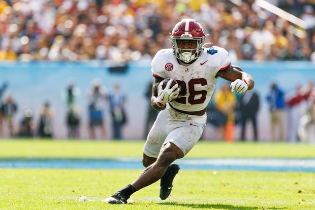Dec 31, 2024; Tampa, FL, USA; Alabama Crimson Tide running back Jam Miller (26) rushes with the ball against the Michigan Wolverines during the first half at Raymond James Stadium. Mandatory Credit: Matt Pendleton-Imagn Images/File Photo