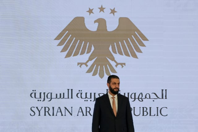 Syrian President Ahmed al-Sharaa attends a signing ceremony of a memorandum of understanding for investment in Syria, in Damascus, Syria August 6, 2025. REUTERS/Khalil Ashawi/File Photo