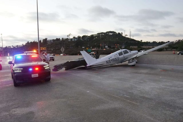 A small plane made an emergency landing in the southbound lanes of Interstate 805 on Saturday shortly after 5:35 p.m., causing significant traffic delays. (Michael Ho / For The San Diego Union-Tribune)