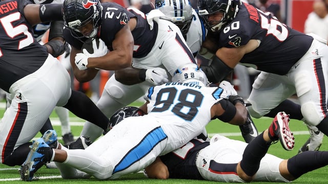 Aug 16, 2025; Houston, Texas, USA; Houston Texans running back Nick Chubb (21) rushes for two yards against the Carolina Panthers in the first quarter at NRG Stadium. Mandatory Credit: Thomas Shea-Imagn Images
