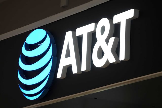 FILE - An AT&amp;T sign is seen at a store in Pittsburgh, Monday, Jan. 30, 2023. 