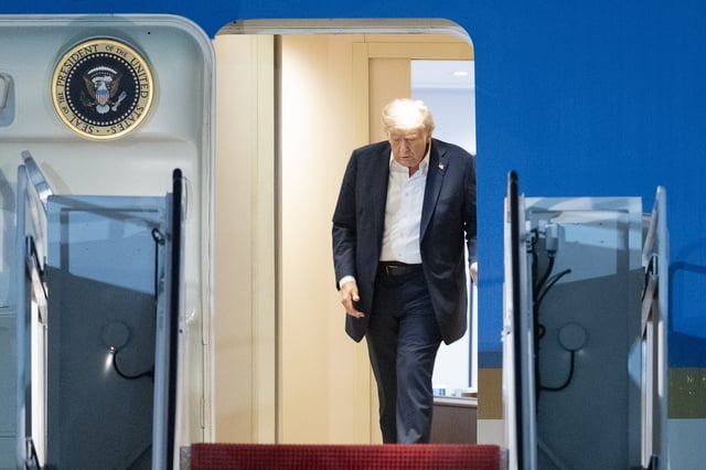President Donald Trump walks to disembark Air Force One as he arrives at Joint Base Andrews, Md., early Saturday, Aug. 16, 2025, from a summit with Russian President Vladimir Putin in Anchorage, Alaska. (AP Photo/Manuel Balce Ceneta)