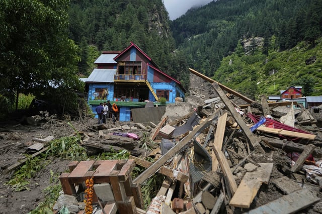 Buildings damaged by Thursday's flash floods are seen in Chositi village, Kishtwar district, Indian-controlled Kashmir, Friday, Aug. 15, 2025. (AP Photo/Channi Anand)