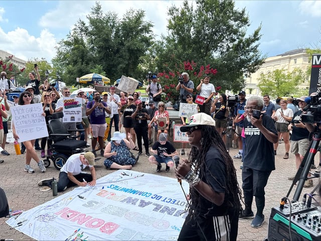 Demonstrators gather near police headquarters to protest Donald Trump’s federal takeover of Washington, DC, on Friday.