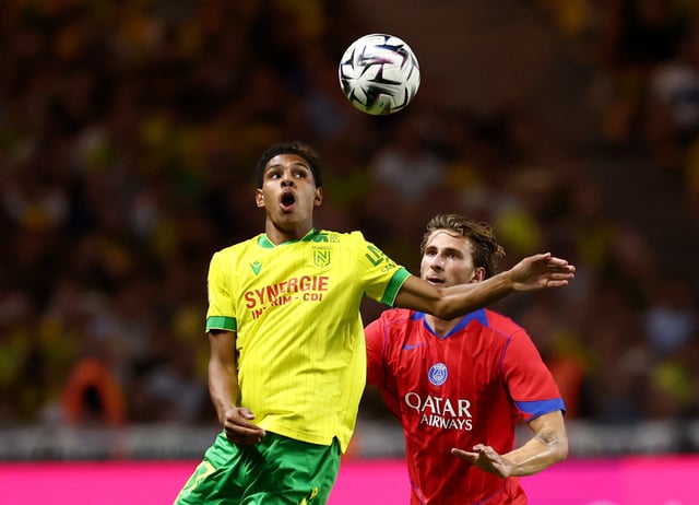 Soccer Football - Ligue 1 - Nantes v Paris St Germain - The Stade de la Beaujoire - Louis Fonteneau, Nantes, France - August 17, 2025 Nantes' Dehmaine Assoumani in action with Paris St Germain's Ilya Zabarnyi REUTERS/Stephane Mahe