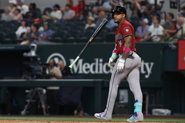 ARLINGTON, TEXAS - AUGUST 13: Ketel Marte #4 of the Arizona Diamondbacks flips his bat after hitting a three-run home run during the ninth inning against the Texas Rangers at Globe Life Field on August 13, 2025 in Arlington, Texas.