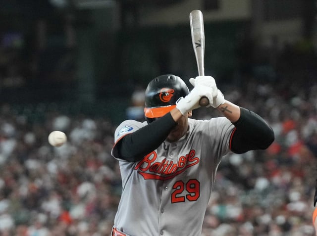 Baltimore Orioles designated hitter Samuel Basallo (29) is hit by a pitch in the second inning against the Houston Astros at Daikin Park in Houston on Sunday, Aug. 17, 2025.