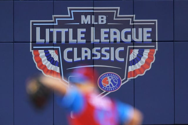Starting pitcher Nick Pivetta #43 of the Philadelphia Phillies delivers a pitch in the foreground against the New York Mets during the MLB Little League Classic BB&amp;T Ballpark on August 19, 2018 in Williamsport, Pennsylvania.