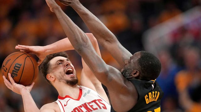 May 2, 2025; San Francisco, California, USA; Houston Rockets center Alperen Sengun (28) shoots the ball around the reach of Golden State Warriors forward Draymond Green (23) in the fourth quarter of game six of the first round for the 2025 NBA Playoffs at Chase Center. Mandatory Credit: Cary Edmondson-Imagn Images