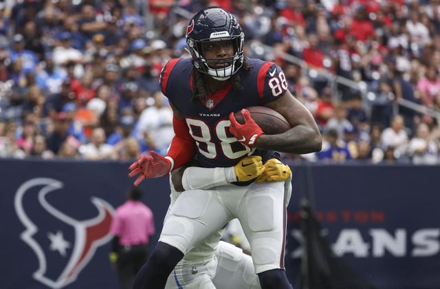 Oct 2, 2022; Houston, Texas, USA; Houston Texans wide receiver John Metchie III (88) makes a reception as Los Angeles Chargers cornerback Asante Samuel Jr. (26) attempts to make a tackle during the fourth quarter at NRG Stadium. Mandatory Credit: Troy Taormina-USA TODAY Sports/File photo