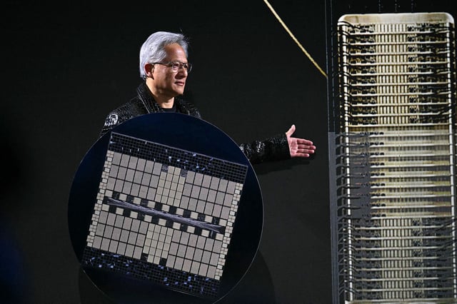 Nvidia CEO Jensen Huang holds a Grace Blackwell NVLink72.