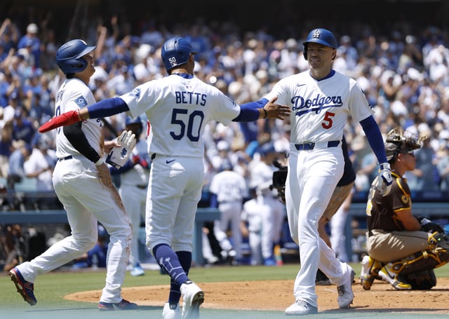 LOS ANGELES, CALIFORNIA – AUGUST 17: Freddie Freeman #5 of the Los Angeles Dodgers celebrates his three run home run with Mookie Betts #50 and Shohei Ohtani #17, in front of Freddy Fermin #54 of the San Diego Padres, to take a 3-0 lead, during the first inning in the game between the San Diego Padres and the Los Angeles Dodgers at Dodger Stadium on August 17, 2025 in Los Angeles, California. (Photo by Harry How/Getty Images)