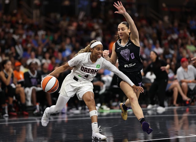 Jordin Canada #3 of the Atlanta Dream drives against Carla Leite #0 of the Golden State Valkyries during the second quarter at Gateway Center Arena on July 29, 2025 in College Park, Georgia.