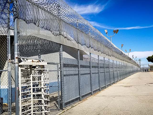 Prison fences and turnstile of Mira Loma Detention Center in Lancaster California.