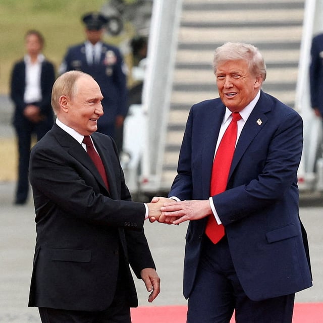 FILE PHOTO: U.S. President Donald Trump shakes hand with Russian President Vladimir Putin, as they meet to negotiate for an end to the war in Ukraine, at Joint Base Elmendorf-Richardson in Anchorage, Alaska, U.S., August 15, 2025. REUTERS/Kevin Lamarque/File Photo