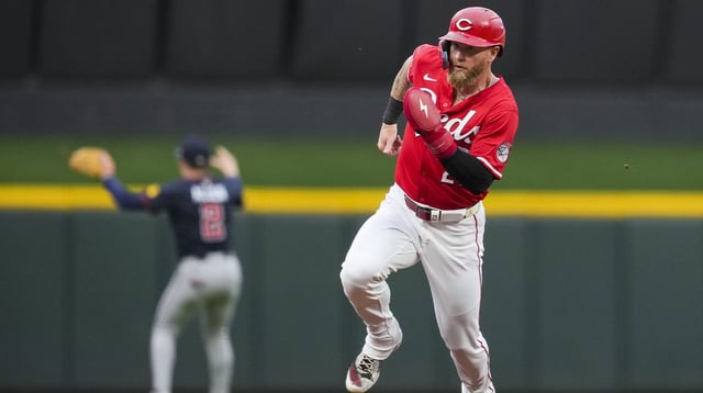 Jul 31, 2025; Cincinnati, OH, USA; Cincinnati Reds outfielder Jake Fraley (27) scores a run on a double hit by catcher Tyler Stephenson in the game against the Atlanta Braves in the second inning at Great American Ball Park. Mandatory Credit: Aaron Doster-Imagn Images