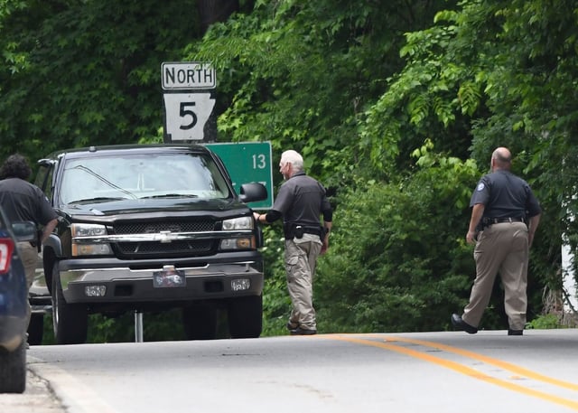 Police set up checkpoints looking for escaped prisoner Grant Hardin near downtown Calico Rock, Arkansas, on May 29.