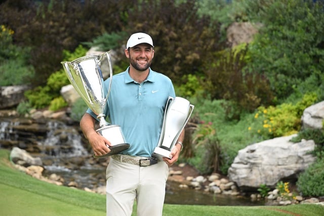 Aug 17, 2025; Owings Mills, Maryland, USA; Scottie Scheffler poses with the J. K. Wadley Trophy and The Keeper after winning the BMW Championship golf tournament. Mandatory Credit: Rafael Suanes-Imagn Images