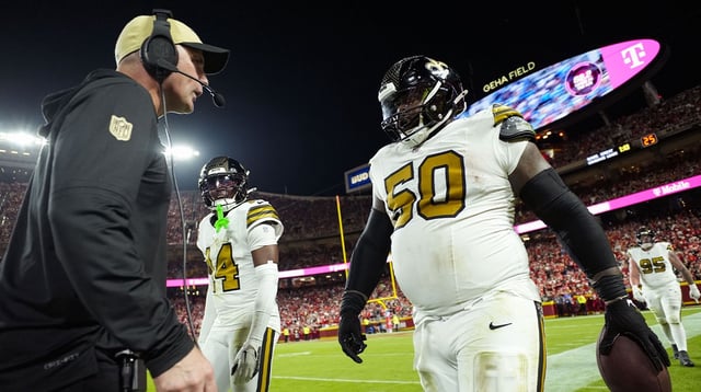 Oct 7, 2024; Kansas City, Missouri, USA; New Orleans Saints defensive tackle Khalen Saunders (50) reacts after an interceptions during the second half against the Kansas City Chiefs at GEHA Field at Arrowhead Stadium. Mandatory Credit: Jay Biggerstaff-Imagn Images