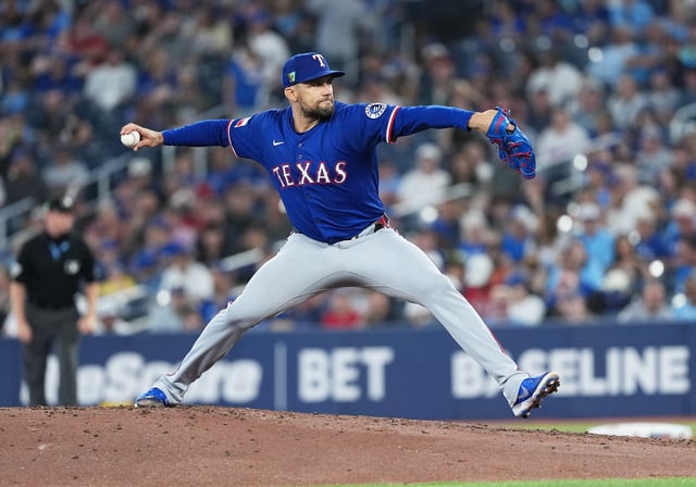Aug 17, 2025; Toronto, Ontario, CAN; Texas Rangers pitcher Nathan Eovaldi (17) throws a pitch against the Toronto Blue Jays during the first inning at Rogers Centre. Mandatory Credit: Nick Turchiaro-Imagn Images