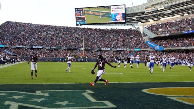 Chicago Bears Olamide Zaccheaus celebrates his touchdown reception against the Buffalo Bills at Soldier Field.