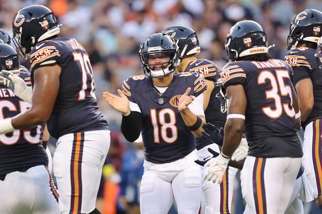 CHICAGO, ILLINOIS - AUGUST 17: Caleb Williams #18 of the Chicago Bears huddles with teammates against the Buffalo Bills during the NFL Preseason 2025 game between Buffalo Bills and Chicago Bears at Soldier Field on August 17, 2025 in Chicago, Illinois. (Photo by Michael Reaves/Getty Images)