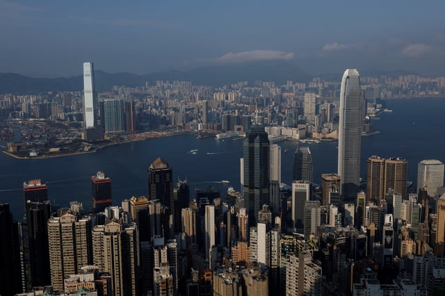 Buildings stand in Hong Kong, China February 24, 2025. REUTERS/Tyrone Siu/File Photo