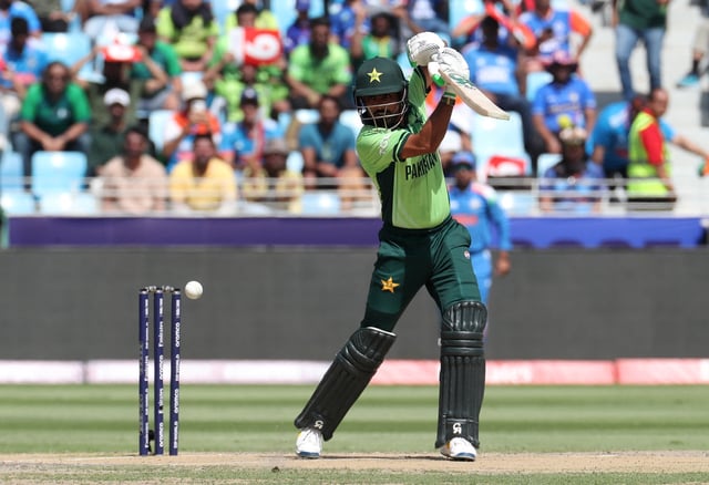 Cricket - ICC Men's Champions Trophy - Group A - India v Pakistan - Dubai International Stadium, Dubai, United Arab Emirates - February 23, 2025 Pakistan's Babar Azam in action REUTERS/Satish Kumar/File Photo