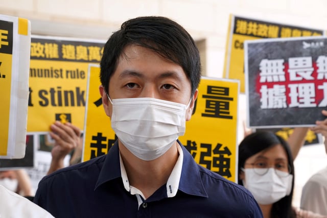 Former pro-democracy lawmaker Ted Hui Chi-fung appears outside West Kowloon Magistrates' Courts in Hong Kong, China November 19, 2020. REUTERS/Lam Yik/File Photo