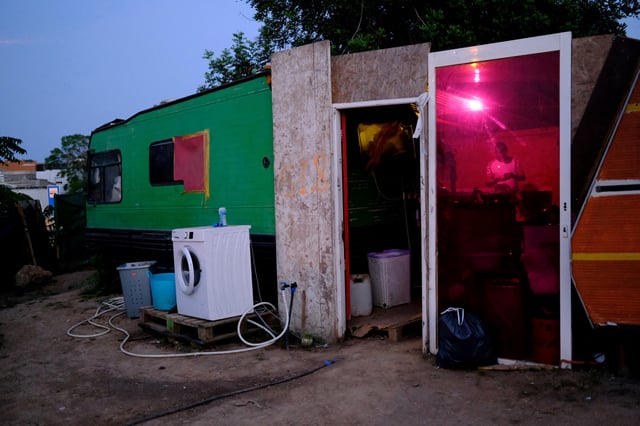 Richard, 35, a housing construction worker, stands inside his shack, where their family lives at a makeshift settlement "Can Rova 2", where workers with their families live due to a severe housing crisis that many locals blame on overtourism in Ibiza, Spain June 11, 2025. Residents and seasonal workers of Spanish island of Ibiza face a housing crisis, intensified by a post-pandemic visitor boom that has priced out many people, forcing them to share flats or stay in tents and motorhomes in unauthorized encampments. REUTERS/Nacho Doce